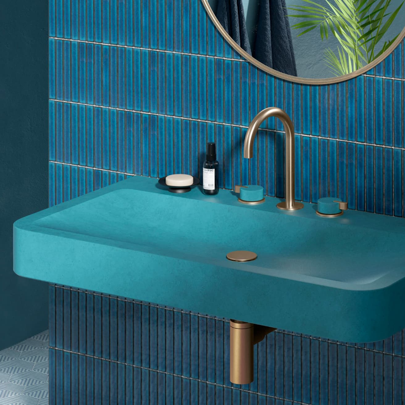 Teal concrete sink with brushed-bronze fittings on glossy blue finger tile (2 of 2)
