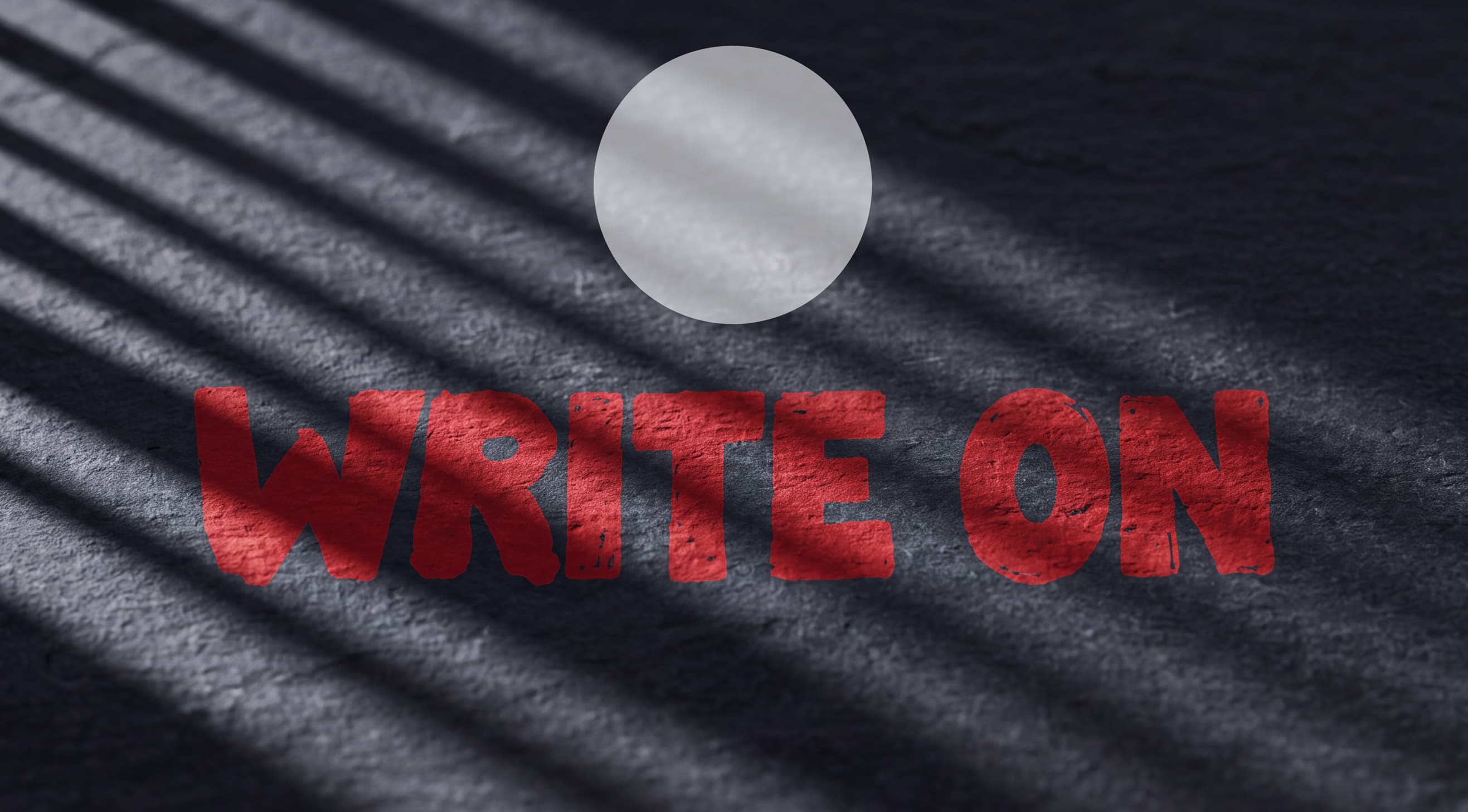 Full-width dark slate surface raked by light: the Sheaffer white dot above 'Write On' hand-painted in red
